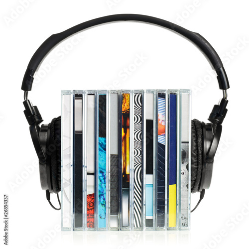 Photo: Headphones on stack of CDs Headphones on stack of CDs