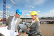 Foto: Architect and supervisor checking site under construction Architect and supervisor checking site under construction