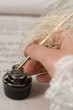 Photo: Writing with feather pen Writing with feather pen