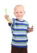 Foto: Child brushing his teeth on a white background Child brushing his teeth on a white background