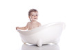 Boy in white bath tub