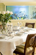 Photo : served table in a dinning room served table in a dinning room
