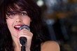 Beautiful rock singer with microphone