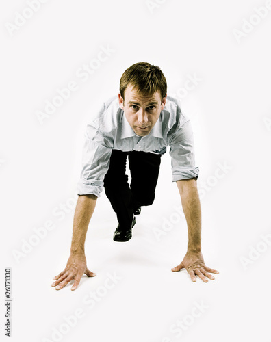 Photo: Businessman in sprint position Businessman in sprint position