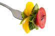 fork with fresh vegetables and oil drops