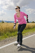 Beautiful young woman sports with roller-skates