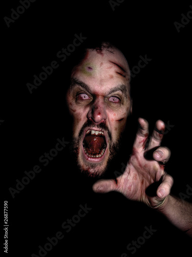Photo: Evil zombie face coming at ya from the dark Evil zombie face coming at ya from the dark