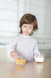 Little boy has a breakfast Little boy has a breakfast