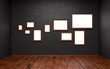 Blank pictures of different sizes in a dark room Blank pictures of different sizes in a dark room