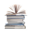 pile of books with one book open