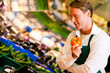 Man in supermarket as shop assistant