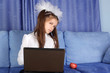 hard day in learning - girl with laptop and red apple in sofa hard day in learning - girl with laptop and red apple in sofa