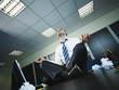 businessman doing yoga in office