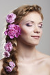 Woman with with braids and roses in hair