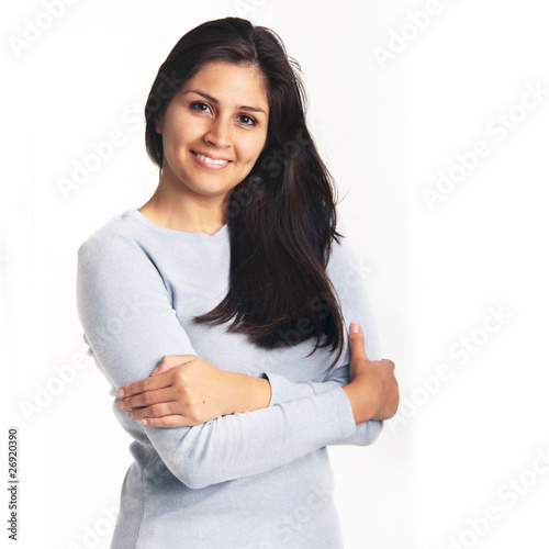 Photo: Young woman smiling portrait isolated on white background Young woman smiling portrait isolated on white background