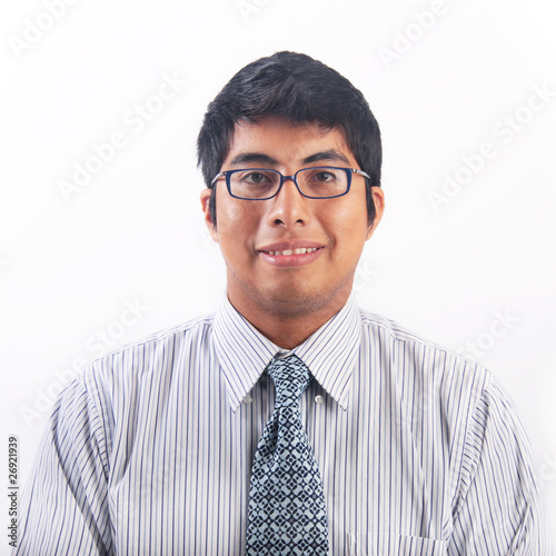 Photo: Geeky young hispanic man with glasses portrait Geeky young hispanic man with glasses portrait