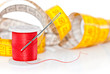 Colored bobbin for sewing and measuring tape over white