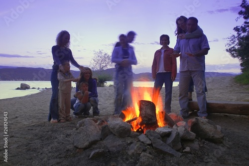 Photo: A Group Of Friends And Family Around A Bonfire On The Beach A Group Of Friends And Family Around A Bonfire On The Beach