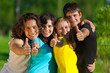 Young group of happy friends showing thumbs up sign Young group of happy friends showing thumbs up sign