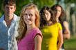 The girl and her friends in the park The girl and her friends in the park