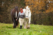 Woman with two horses
