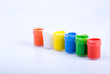 Colored paints on a white background Colored paints on a white background