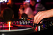DJ playing vinyl on turntable