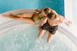 Top view - young couple relax in swimming pool