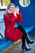 Young woman sitting on station stop Young woman sitting on station stop