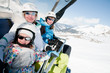 Sporty family on ski lift