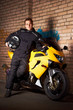 Photo: Biker in a black coats and his motorcycle Biker in a black coats and his motorcycle