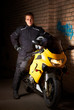 Photo: Biker in a black coats and his motorcycle Biker in a black coats and his motorcycle