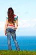 The back of an attractive woman relaxing and looking at the view