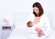 Foto: Mother feeding baby with breast Mother feeding baby with breast