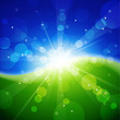 Summer blurred image with sun and meadow.