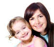 Smiling faces of mother with daughter