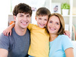 Happy faces of young family