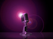 classic microphone with pink light background