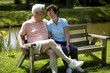 Happy senior couple sitting on a bench Happy senior couple sitting on a bench