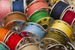 Photo: Colorful spools of yarn in a close-up Colorful spools of yarn in a close-up