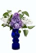 Lilac branches in a dark blue vase Lilac branches in a dark blue vase