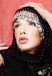 pretty woman with arabian black scarf