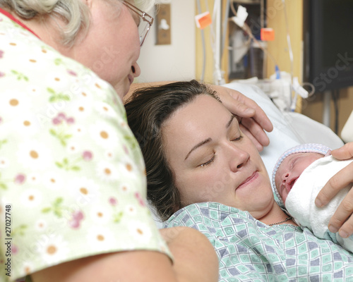 Photo: Mother and grandmother with newborn baby right after delivery Mother and grandmother with newborn baby right after delivery