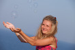 girl enjoys soap bubbles