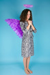 Woman with angel's wing and halo on her head Woman with angel's wing and halo on her head
