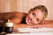 beautiful smiling female lying down in beauty salon