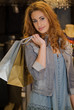 Woman shopping in a cloth shop