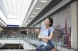 Young woman sits in new Voronezh shopping centre