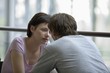 Young couple sit in food hall of shopping mall, Voronezh