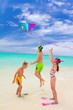 Three kids playing on beach